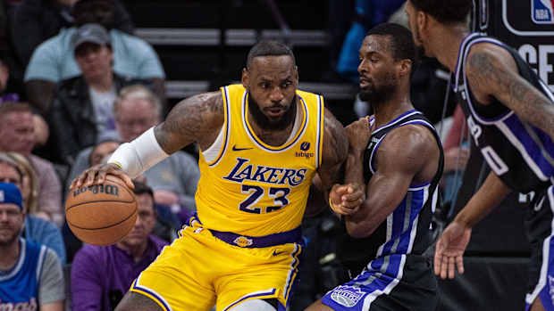 Mar 13, 2024; Sacramento, California, USA; Sacramento Kings forward Harrison Barnes (40) defends against Los Angeles Lakers forward LeBron James (23) during the fourth quarter at Golden 1 Center. Mandatory Credit: Ed Szczepanski-USA TODAY Sports  